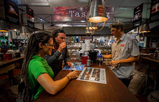 Guests sipping free coffee tastings at Yahava Koffee Academy
