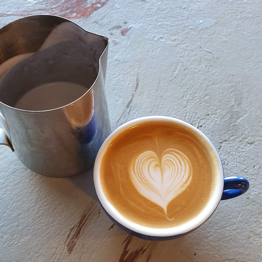 Deliciously poured flat white coffee with silky milk and latte art. Learn how to brew Perth's best coffee with Yahava.